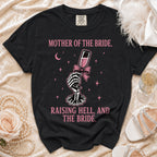 Black t-shirt with "Mother of the Bride, Raising Hell, and The Bride" text.