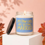 Candle with a lit wick and a blue label reading "MY PAW-ENTS ARE GETTING MARRIED".
