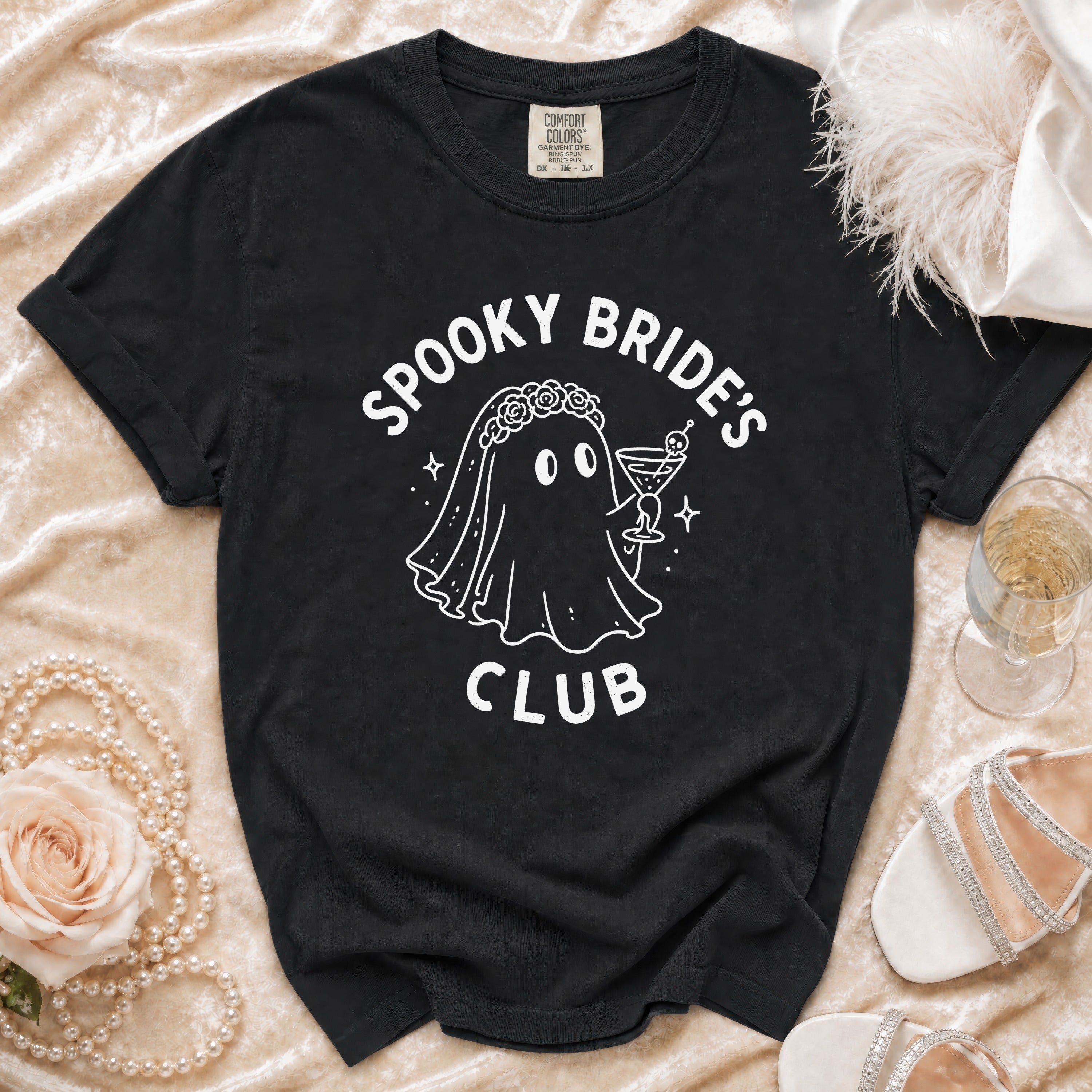 Black t-shirt with "Spooky Bride's Club" ghost graphic and festive accessories.