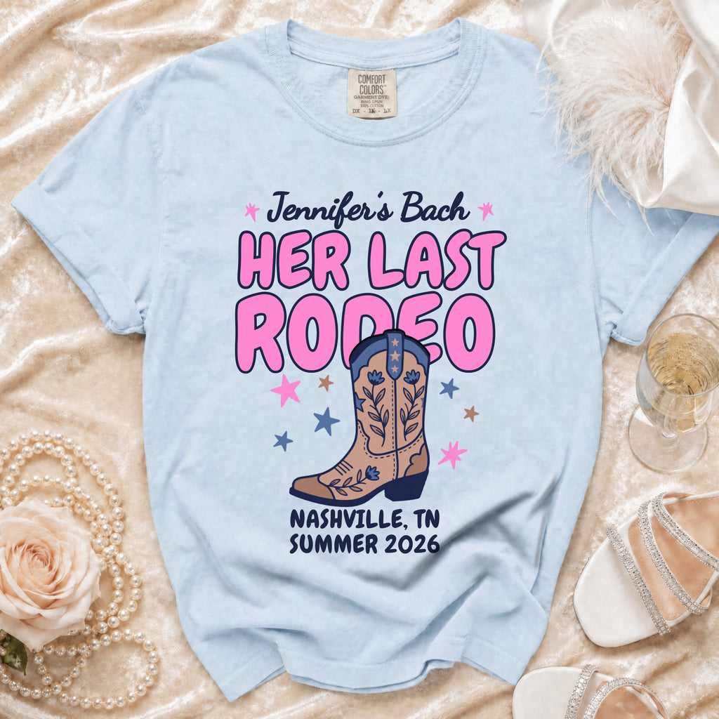 Light blue t-shirt with "Jennifer's Bach HER LAST RODEO" and cowboy boot graphic.