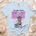 Light blue t-shirt with "Jennifer's Bach HER LAST RODEO" and cowboy boot graphic.
