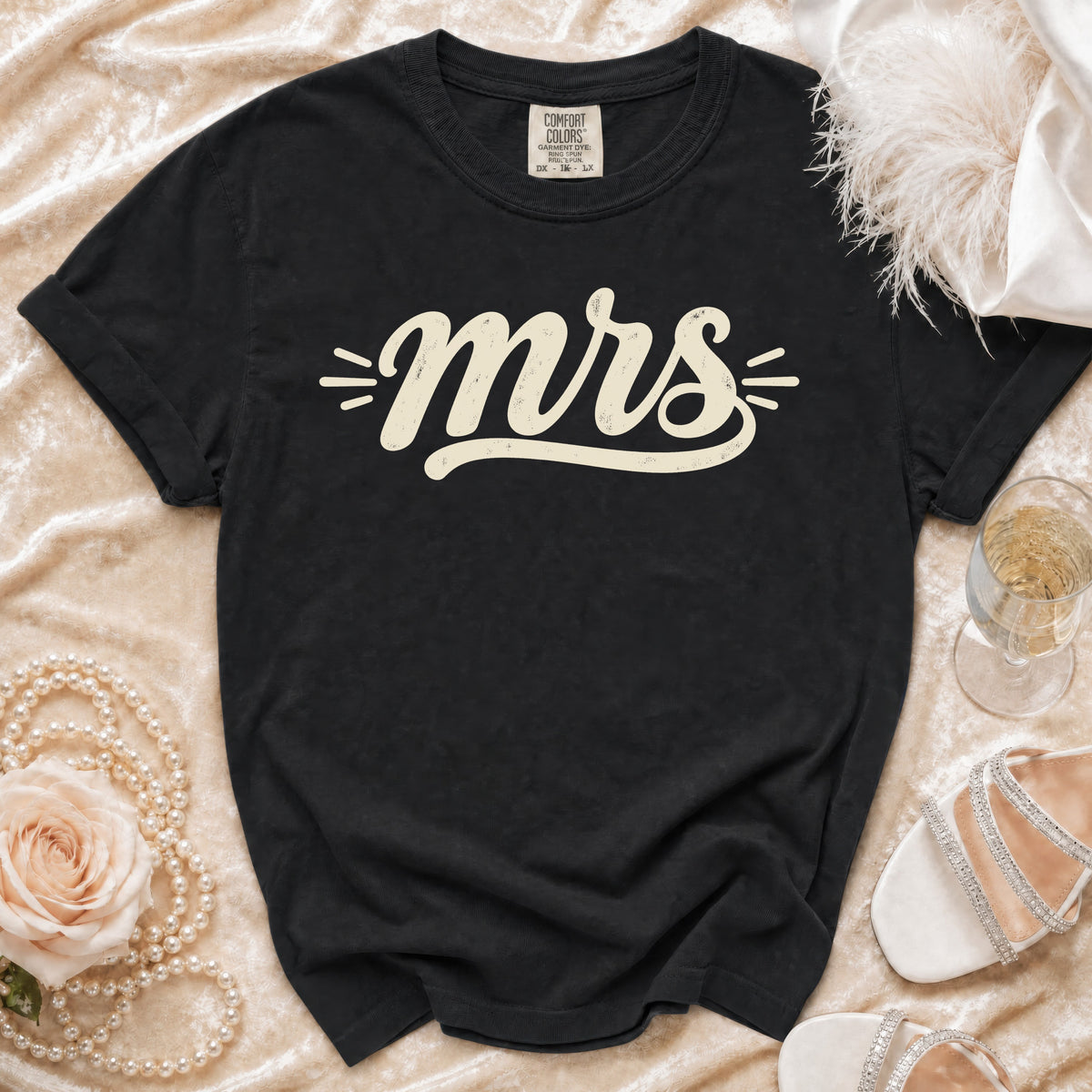 Black t-shirt with cream "mrs" graphic and Comfort Colors tag.