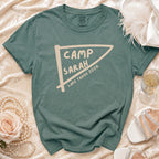 Teal t-shirt with "CAMP SARAH LAKE TAHOE 2026" graphic.