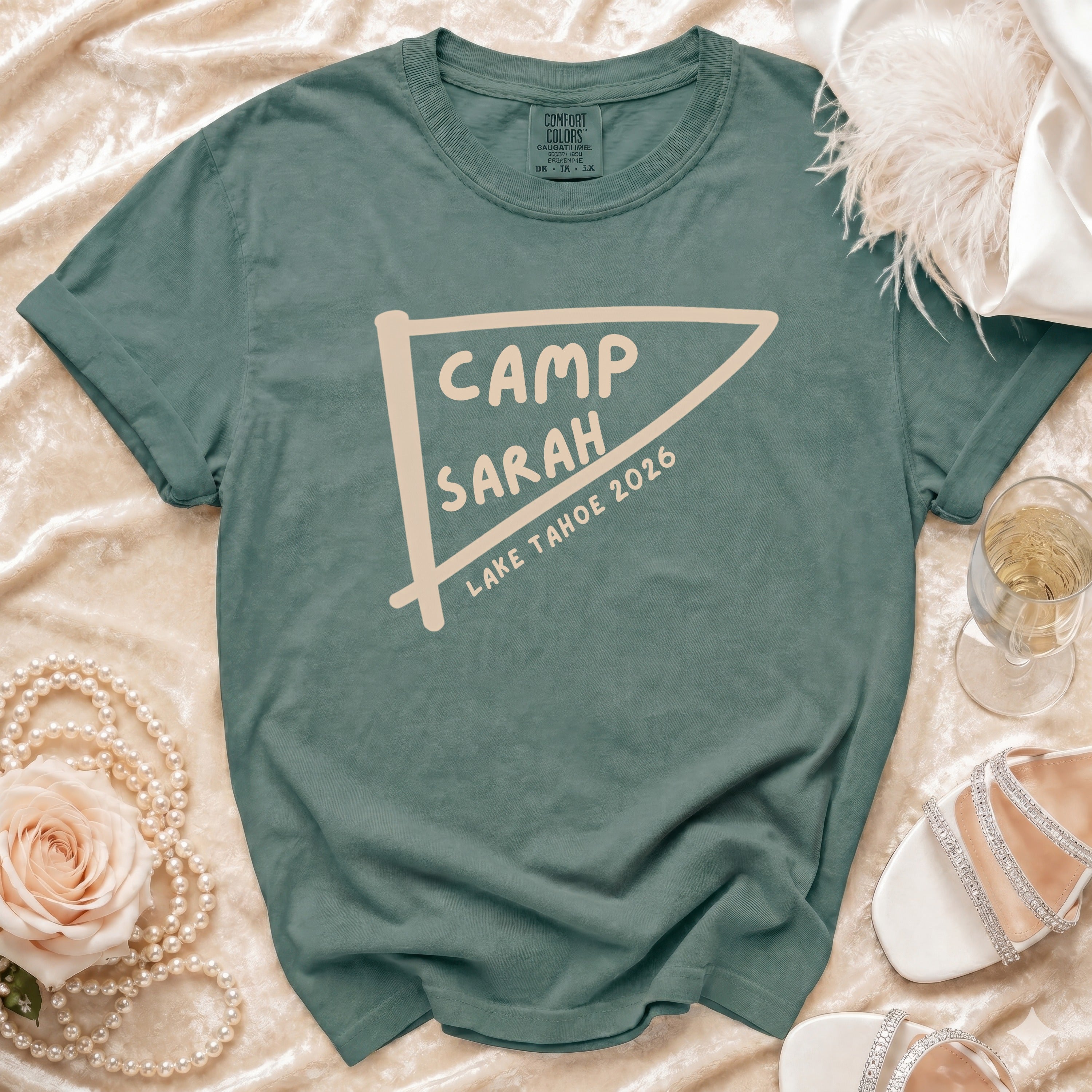Teal t-shirt with "CAMP SARAH LAKE TAHOE 2026" graphic.