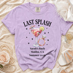 Purple t-shirt with "Last Splash" text, ring, cocktail, and bachelorette party details.