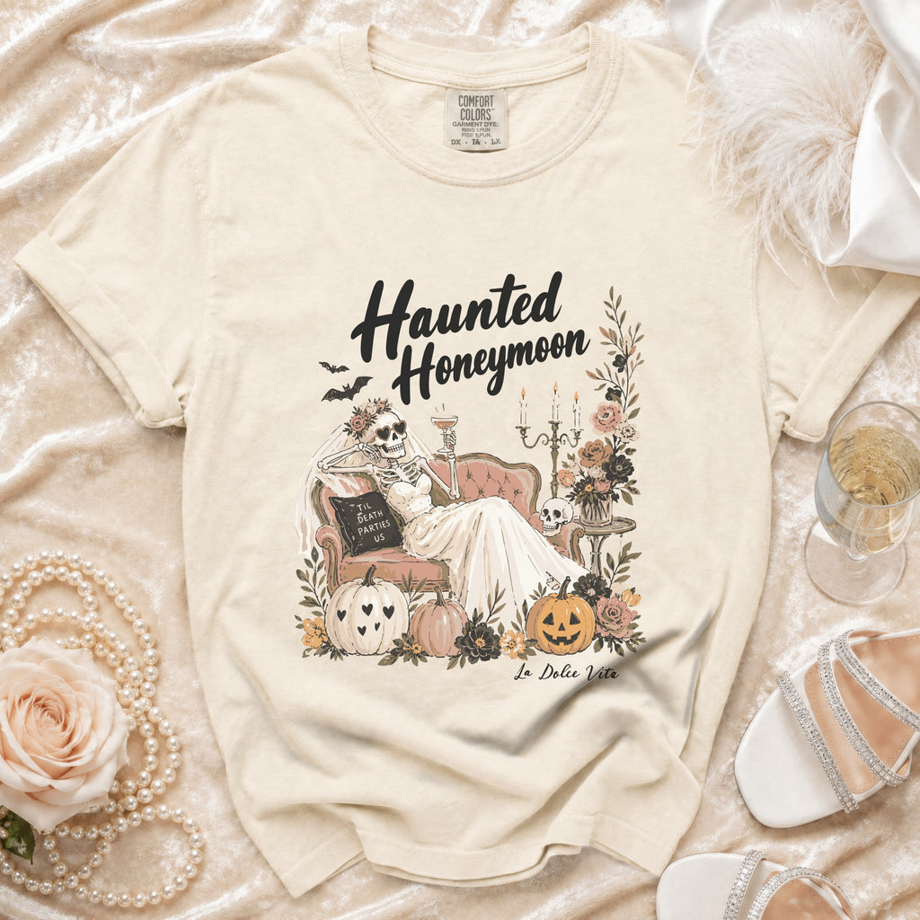 T-shirt with "Haunted Honeymoon" design featuring a skeleton bride and pumpkins.
