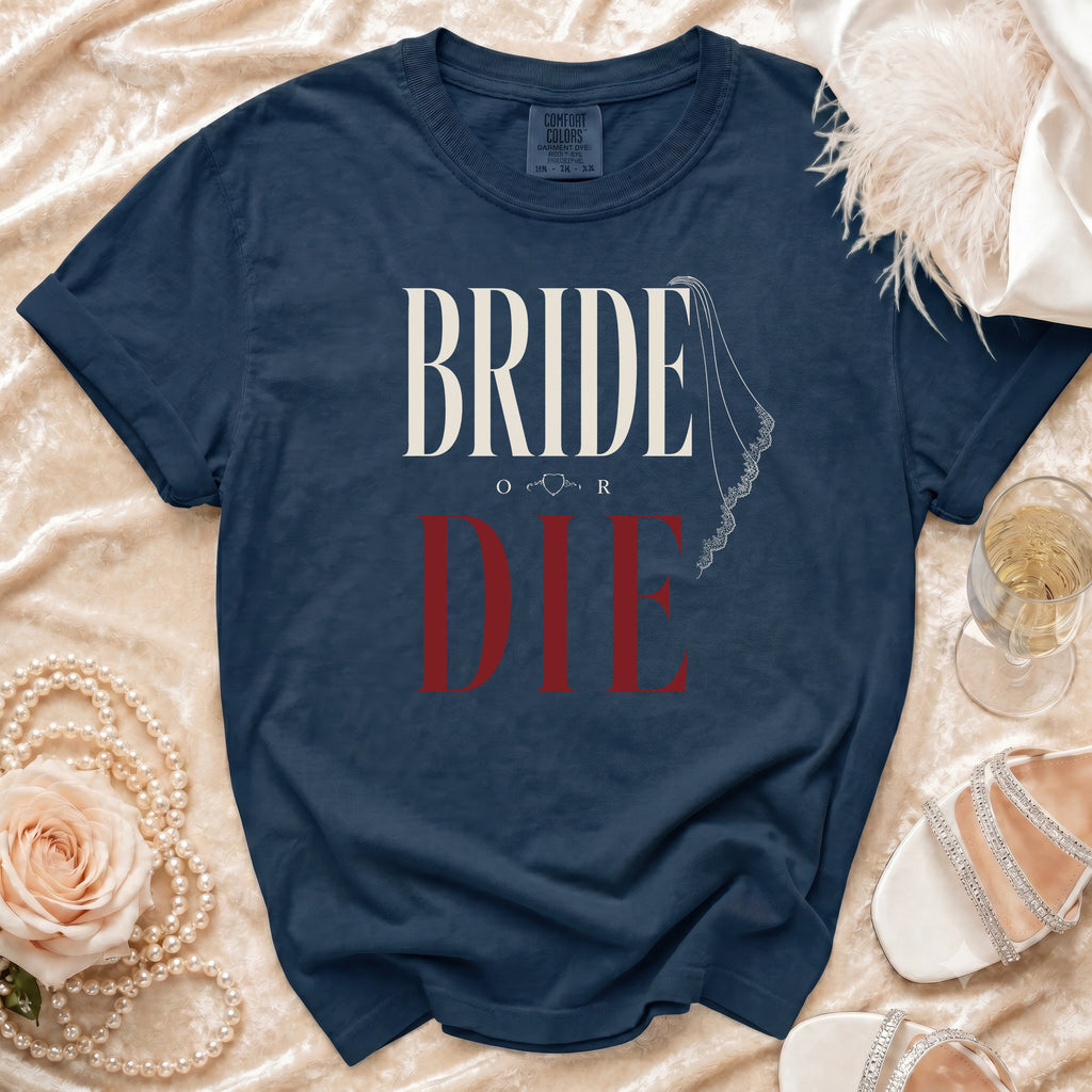 Navy t-shirt with white and red "BRIDE OR DIE" text and veil graphic.