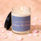 Lit glass candle with label "CAN'T DO THIS Without My Person" surrounded by pink petals.