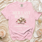 Pink t-shirt with "Her Last Rodeo" text, cowgirl hat, and event details.