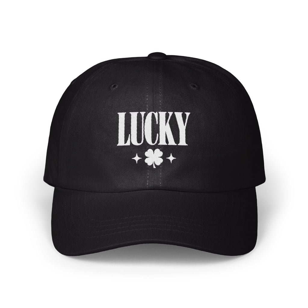 Black baseball cap with white embroidered text reading "LUCKY" above a four-leaf clover and two small stars.