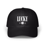 Black baseball cap with white embroidered text reading "LUCKY" above a four-leaf clover and two small stars.