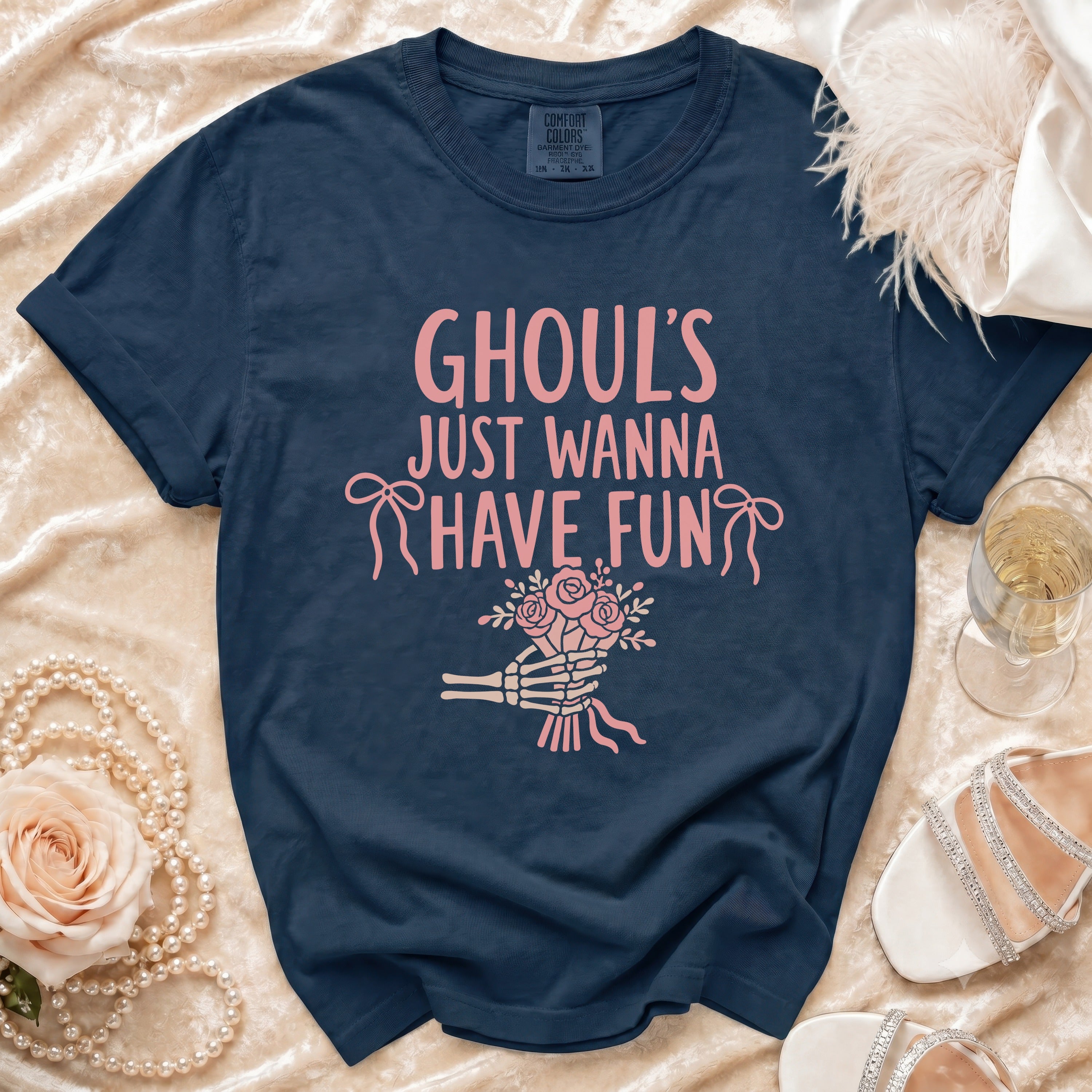 Navy t-shirt with pink text "GHOUL'S JUST WANNA HAVE FUN" and skeleton hand holding flowers.