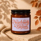 Amber candle jar with "Nearlyweds in Bloom" text on label.