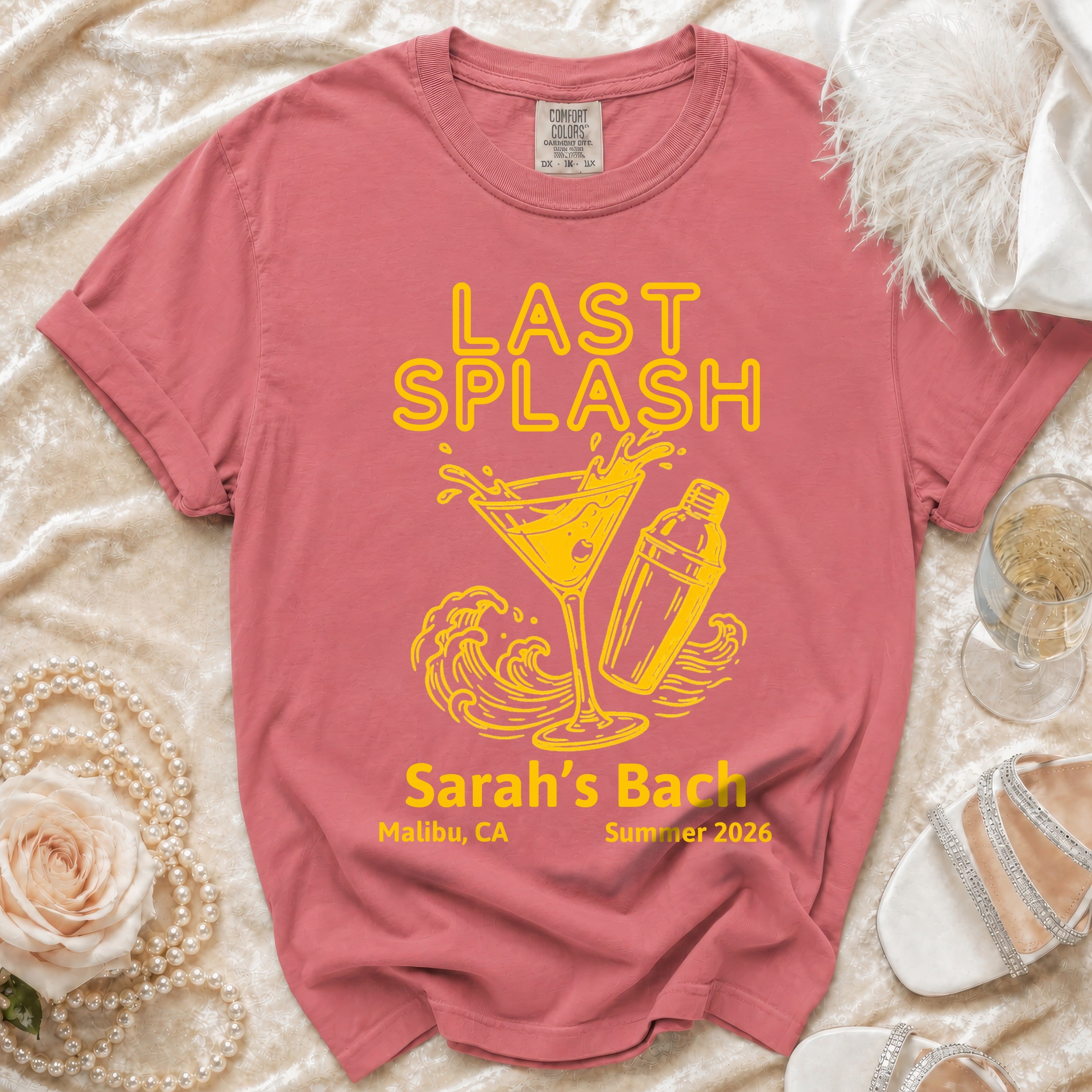 Salmon t-shirt with "LAST SPLASH" text, martini glass, shaker, and waves.