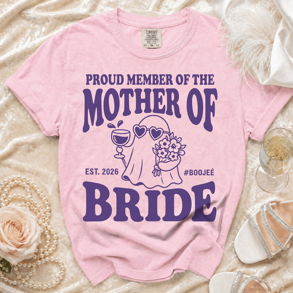 Pink t-shirt with "Proud Member of the Mother of Bride" graphic.