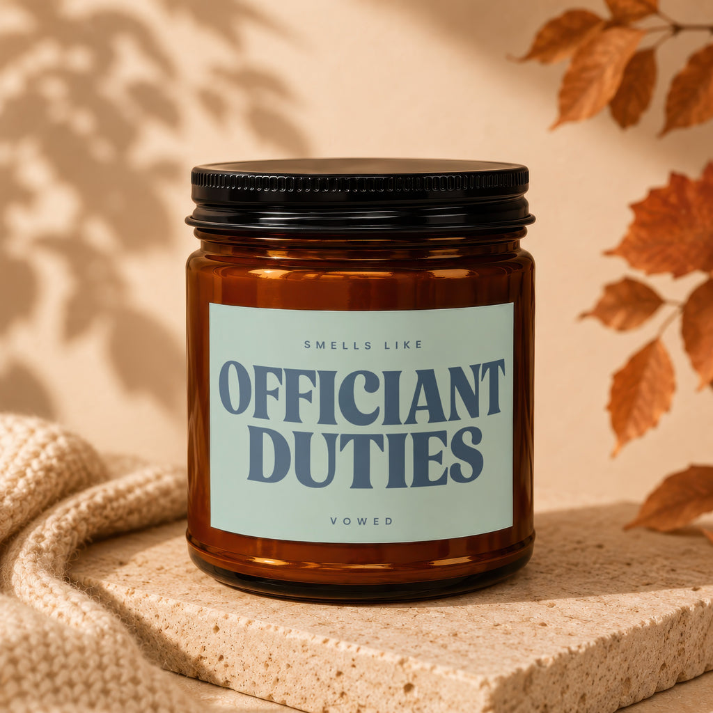 Amber candle with "Officiant Duties" text on a light blue label.