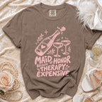 Brown t-shirt design with pink text "Maid of Honor Because Therapy is Expensive".