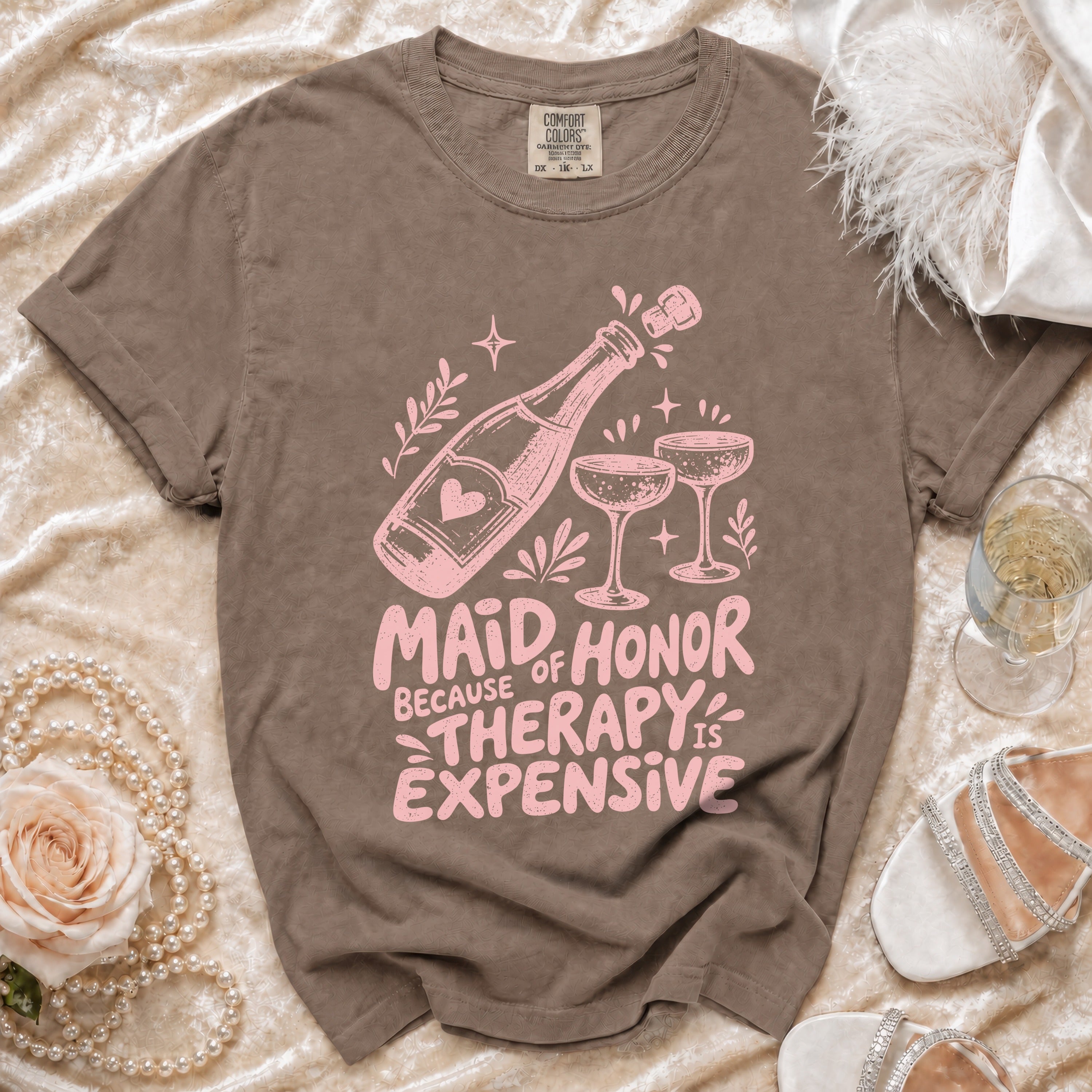 Brown t-shirt design with pink text "Maid of Honor Because Therapy is Expensive".
