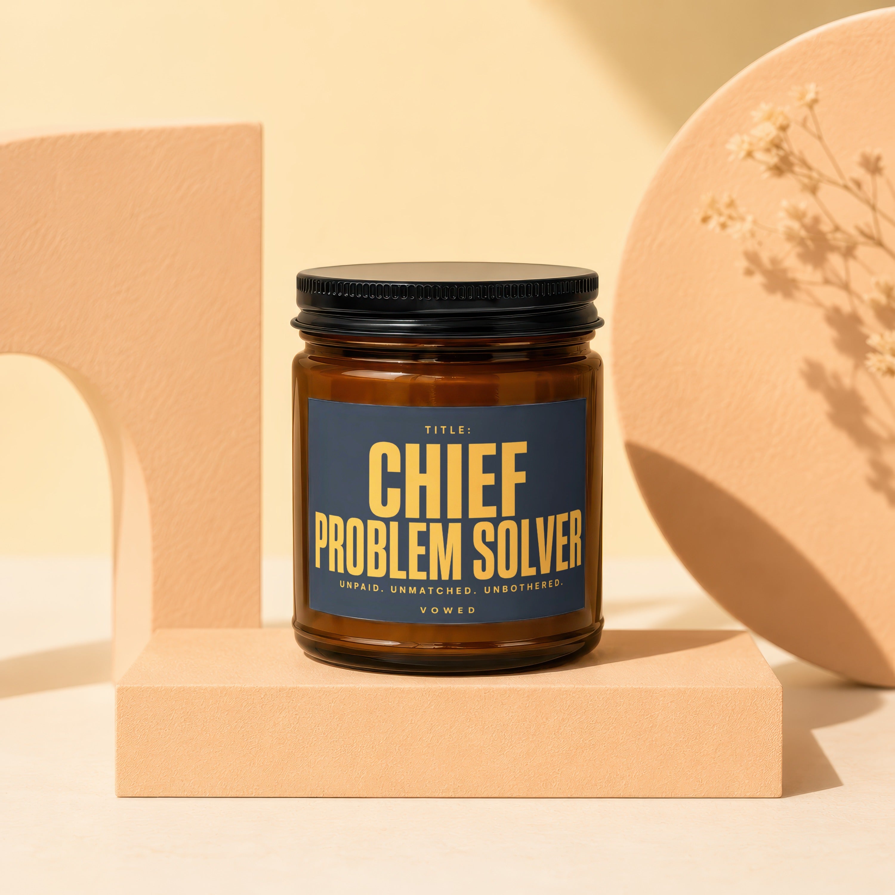 Candle with "CHIEF PROBLEM SOLVER" label and text "VOWED" on a pedestal.