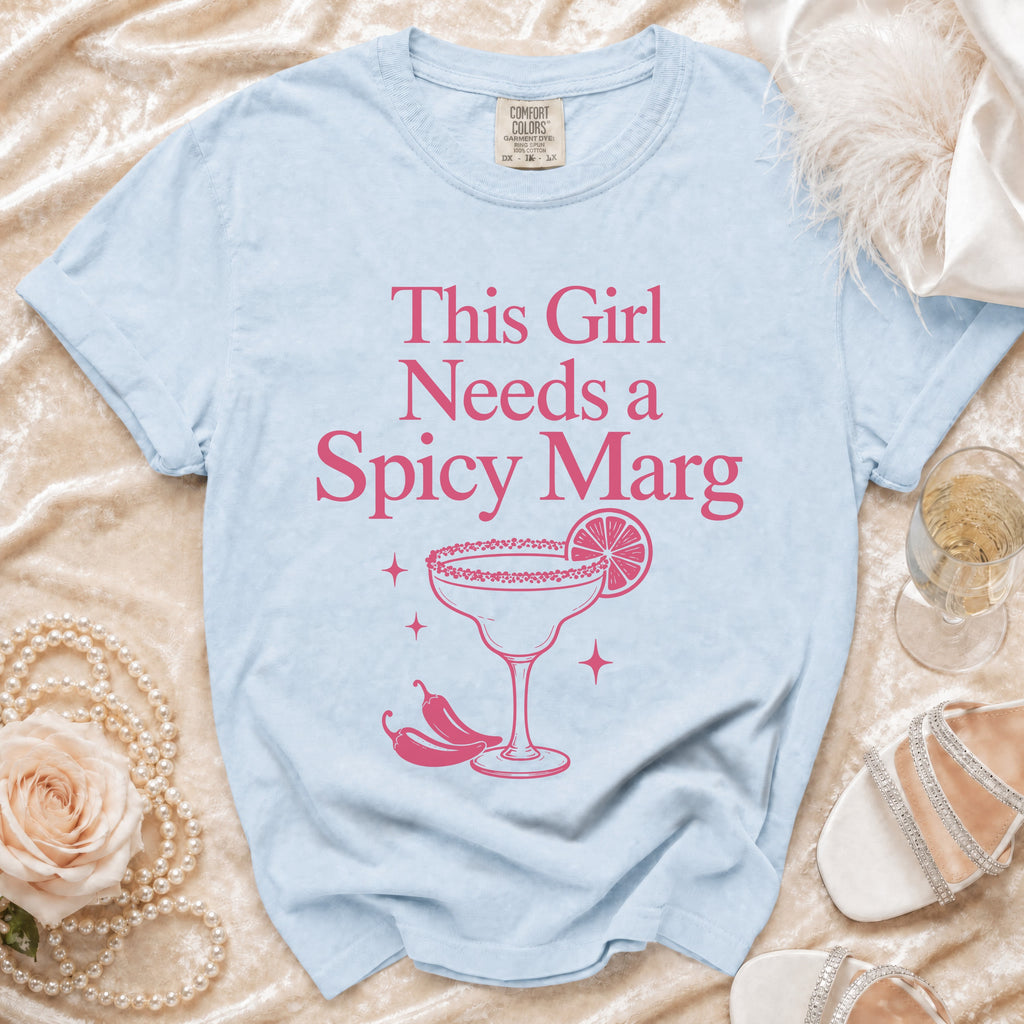 Light blue t-shirt with pink text and graphics of a margarita and chili peppers.