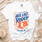 White t-shirt with "Jennifer's Bach" and "Her Last Rodeo" in orange and blue.