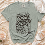 T-shirt graphic "Holding Her Dress and Her Secrets" with champagne and makeup.