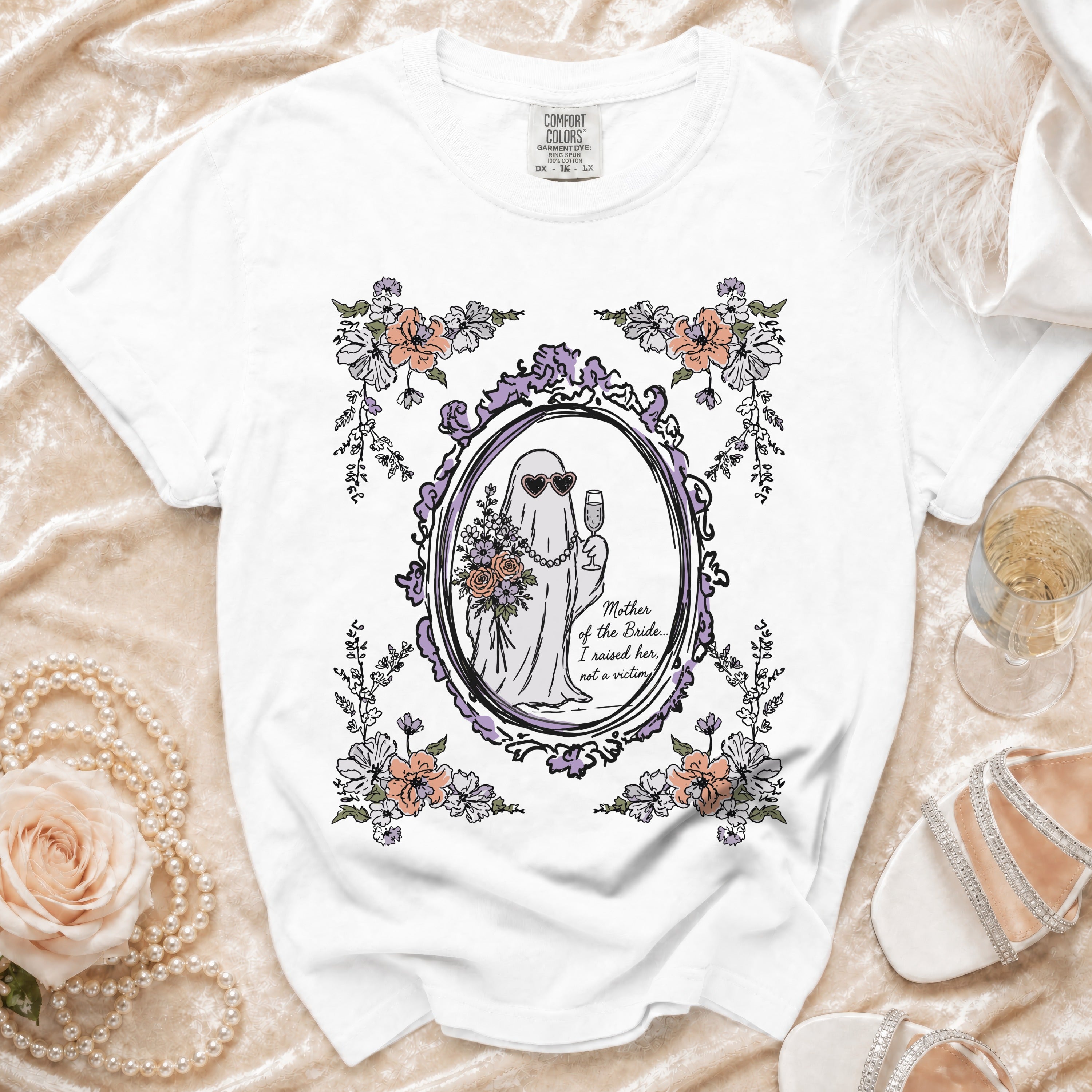 White t-shirt with a ghost bride, champagne, and floral design. "Mother of the Bride... I raised her, not a victim" text.