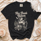 Black t-shirt with "This Bride Bites" text and vampire bride graphic.