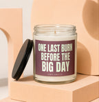 Candle with "ONE LAST BURN BEFORE THE BIG DAY" text on label.