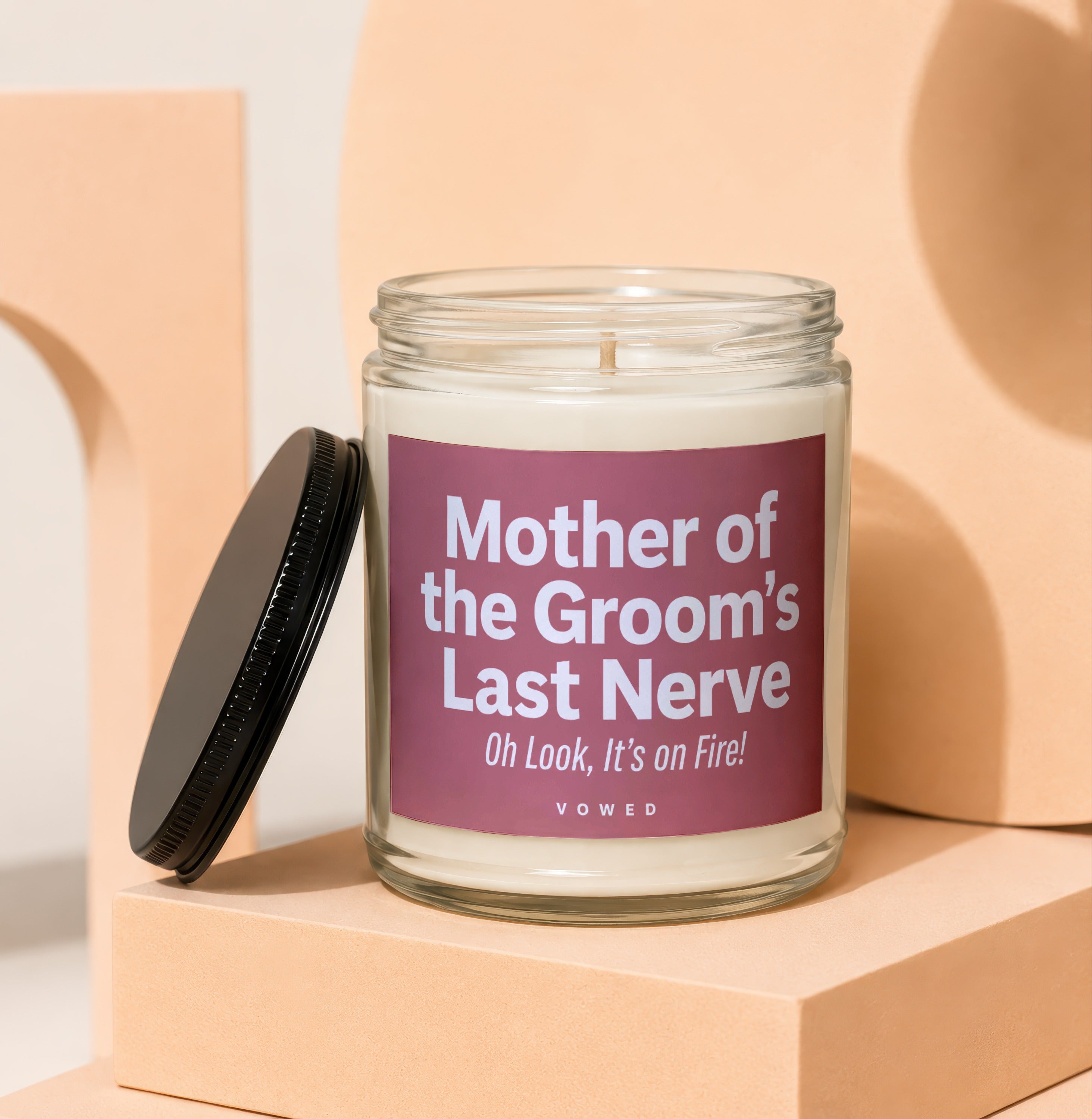 Jar candle with text "Mother of the Groom's Last Nerve" and "VOWED".