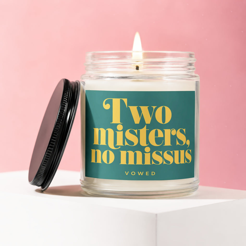 Glass candle with teal label reading "Two misters, no missus," VOWED.