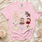 Pink t-shirt with Winter Bride graphic including champagne tower, ice skates, and ring.