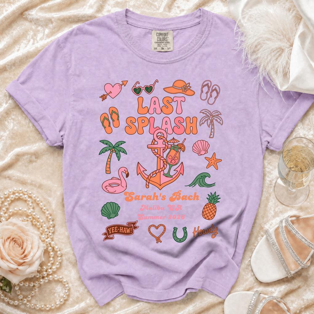 Purple t-shirt with "Last Splash" graphic, palm trees, flamingos, and text.