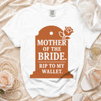 White t-shirt with "Mother of the Bride. Rip to my wallet." text on a tombstone graphic.