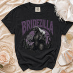 Black t-shirt with Bridezilla graphic of Godzilla wearing a veil and holding flowers.
