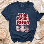 Navy t-shirt with "This Bride Bites" text and wedding graphics.