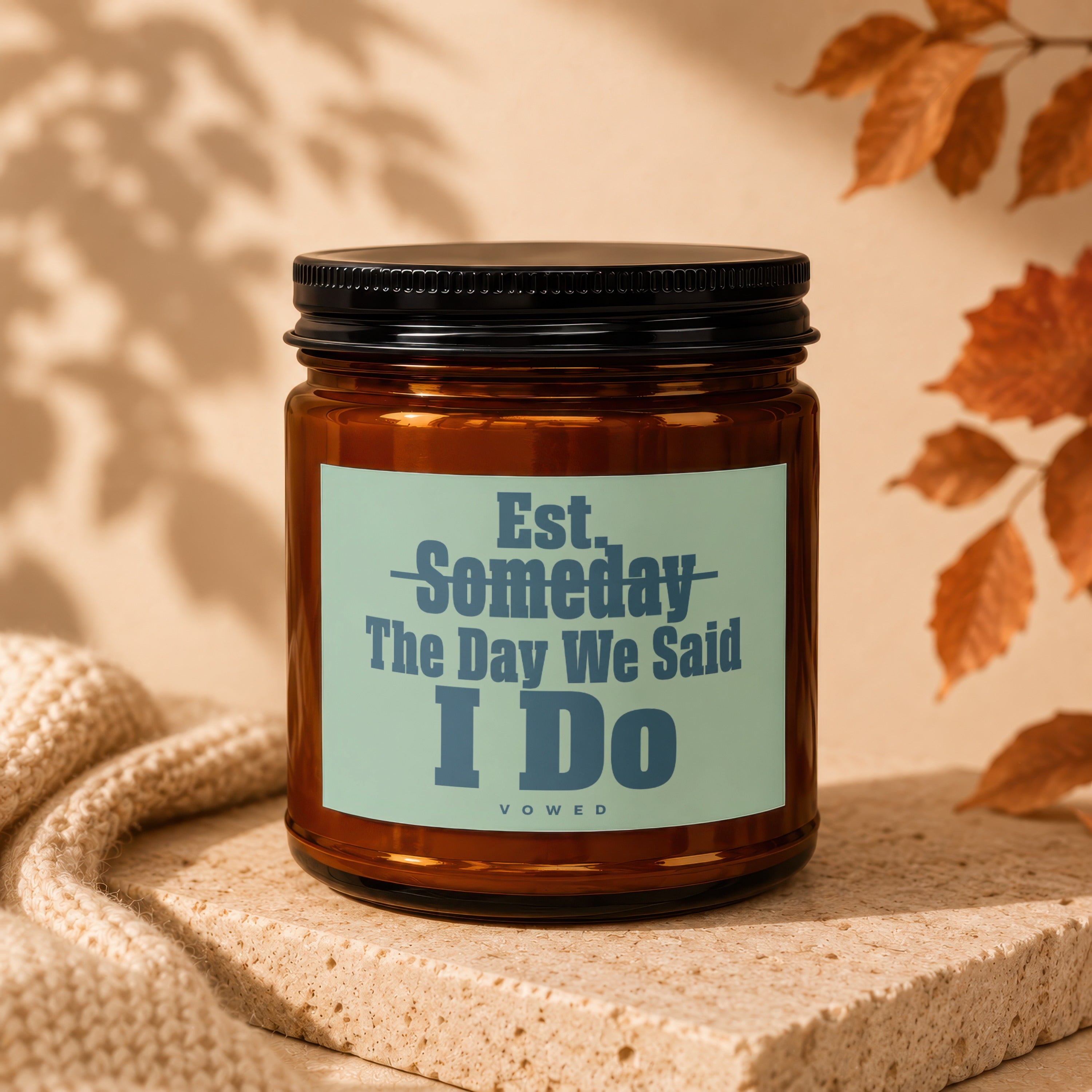 Amber jar candle with "Est. Someday The Day We Said I Do Vowed" label.