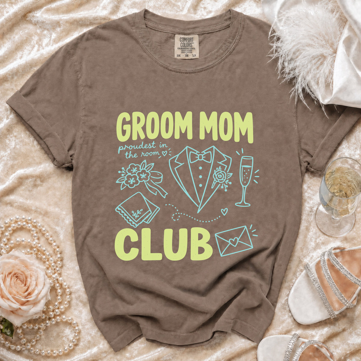 Brown t-shirt with "GROOM MOM CLUB" text and wedding icons.