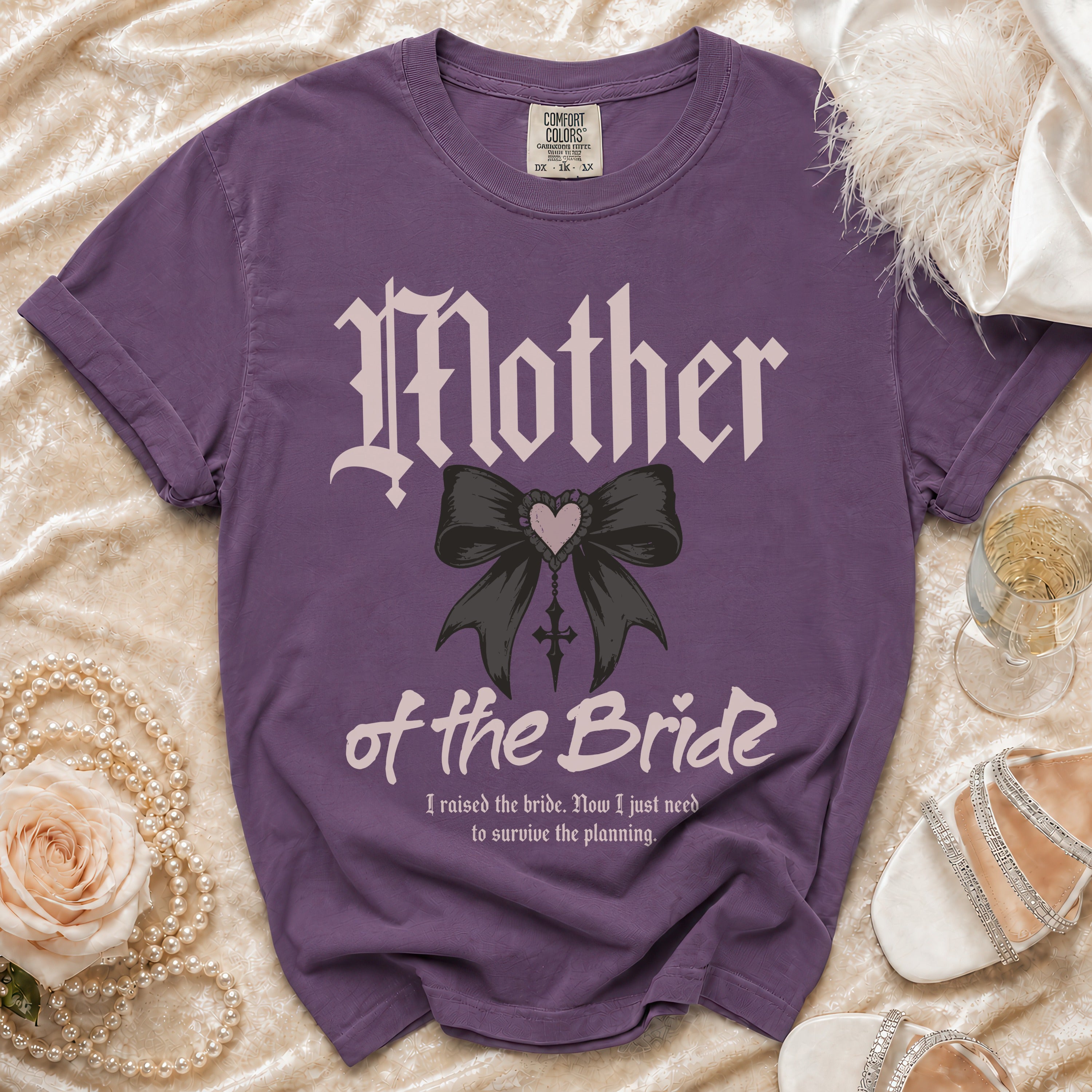 Purple t-shirt reading "Mother of the Bride" with a bow and "I raised the bride. Now I just need to survive the planning."