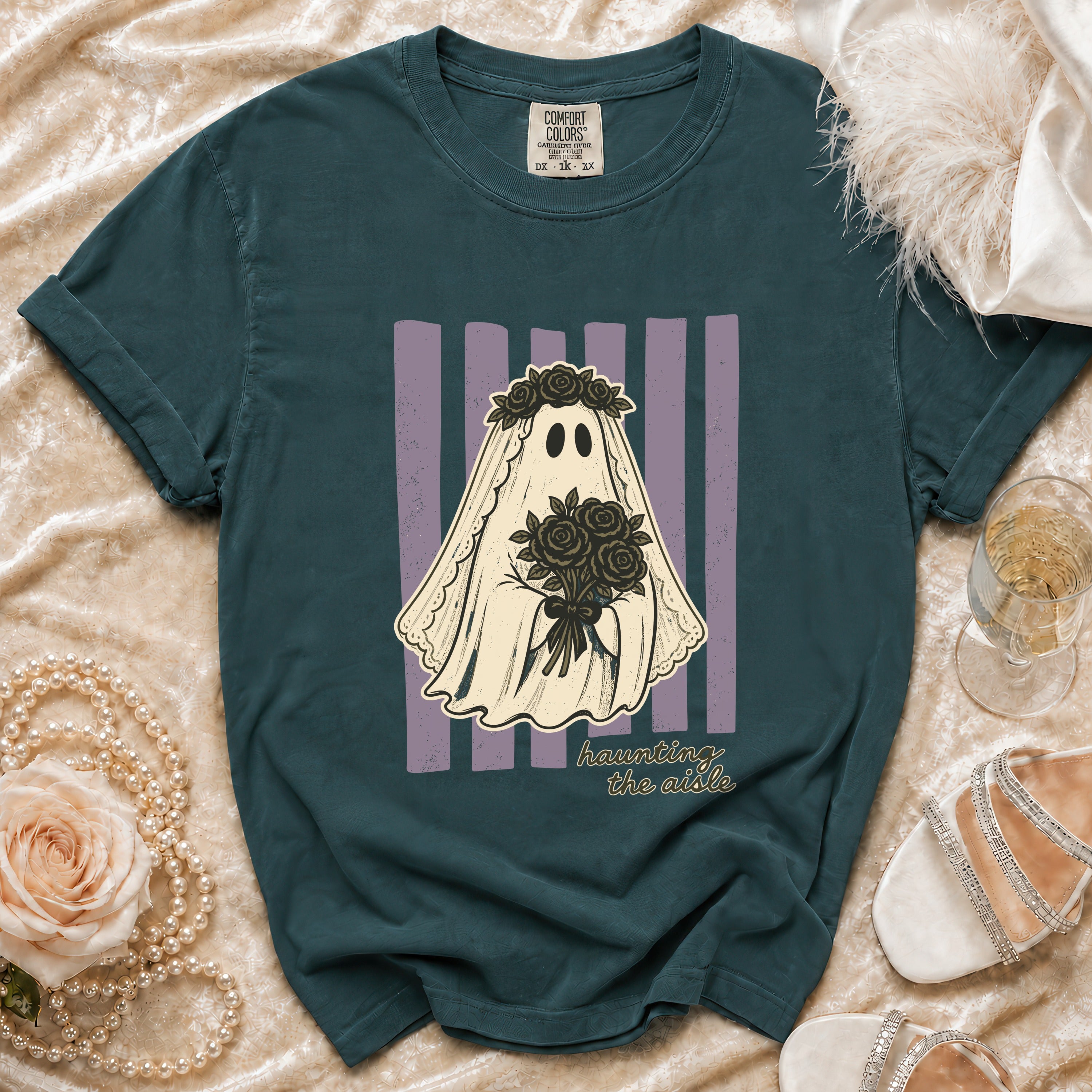 Teal t-shirt with ghost bride graphic holding roses, "haunting the aisle" text.