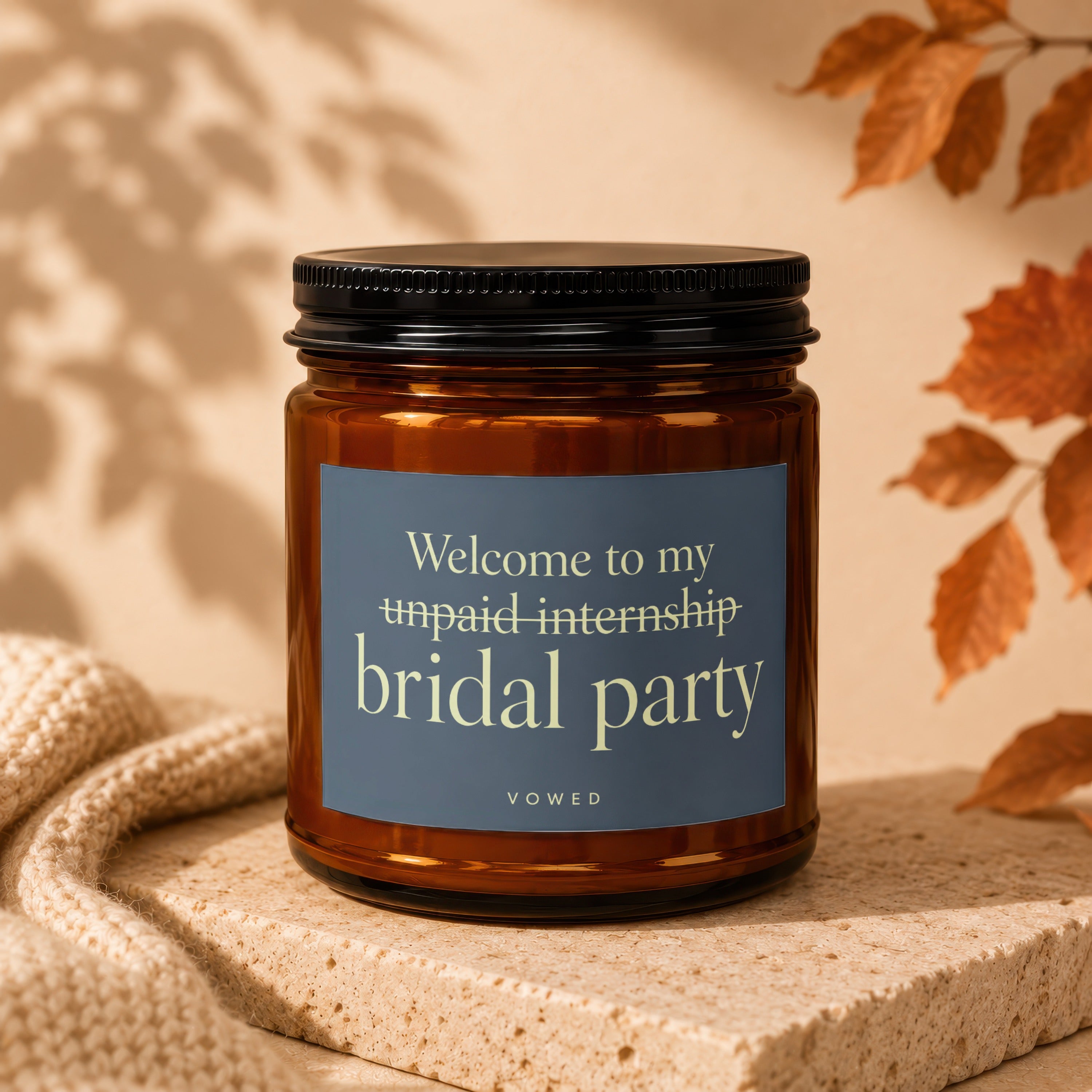 Candle with label "Welcome to my unpaid internship bridal party VOWED".