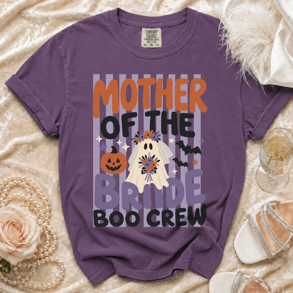 A purple t-shirt featuring a Halloween ghost bride graphic and the text Mother of the Bride Boo Crew.