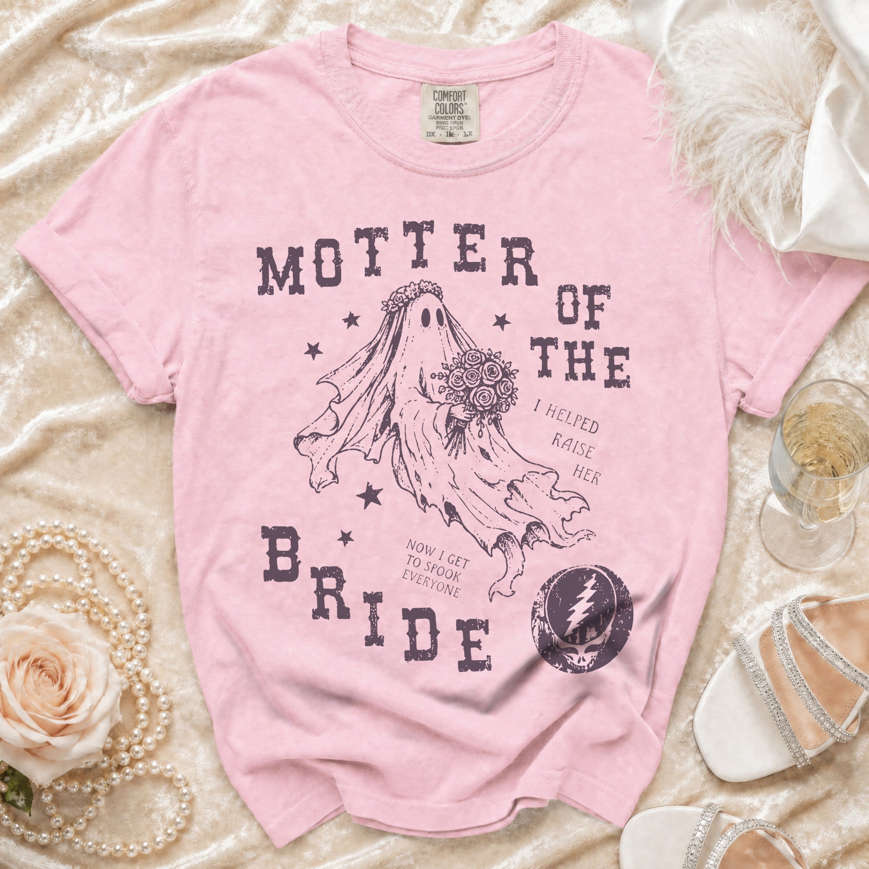 Pink t-shirt with "Mother of the Bride" text and a ghost graphic holding flowers.