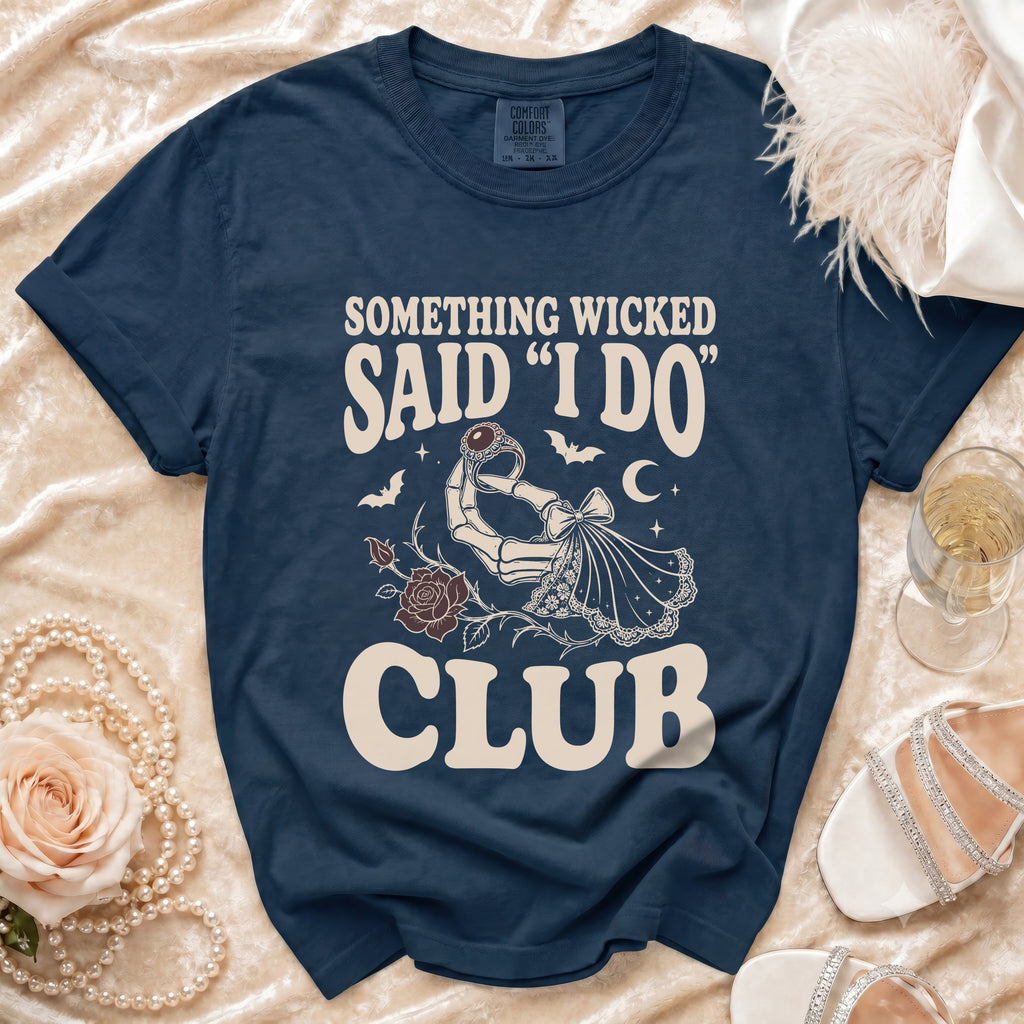 Navy t-shirt with "Something Wicked Said I Do Club" graphic and skeleton hand.