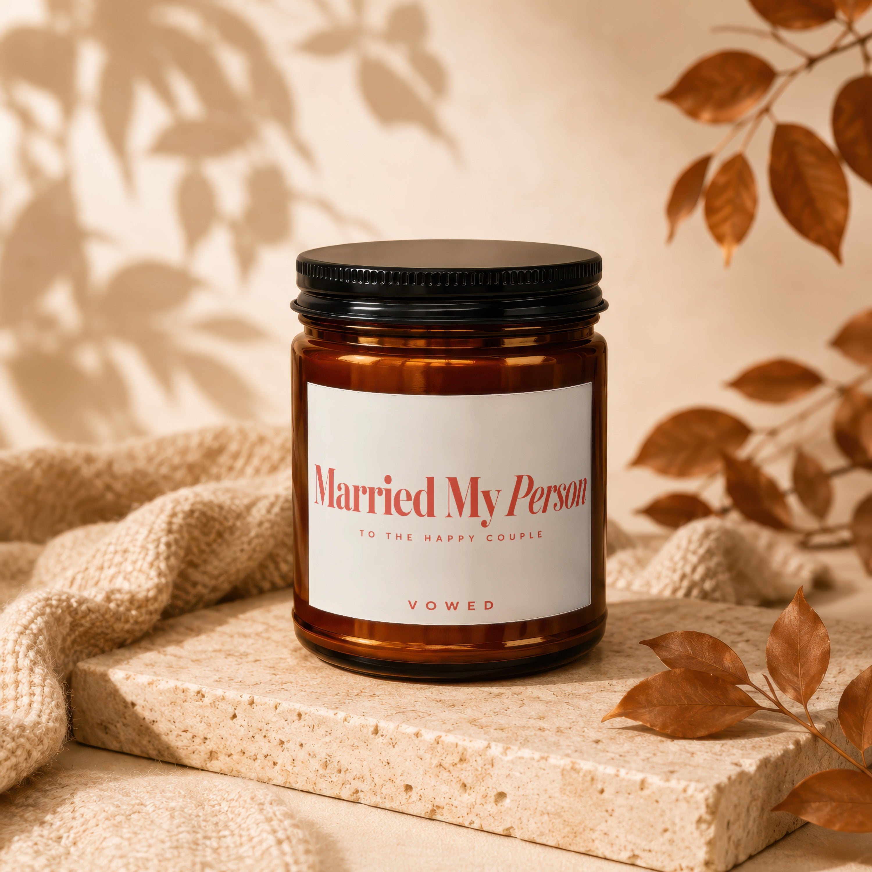 Amber candle with a black lid reads "Married My Person" and "VOWED".