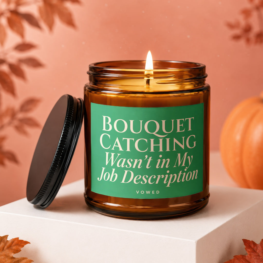 Amber jar candle with green label that reads "Bouquet Catching Wasn't in My Job Description"