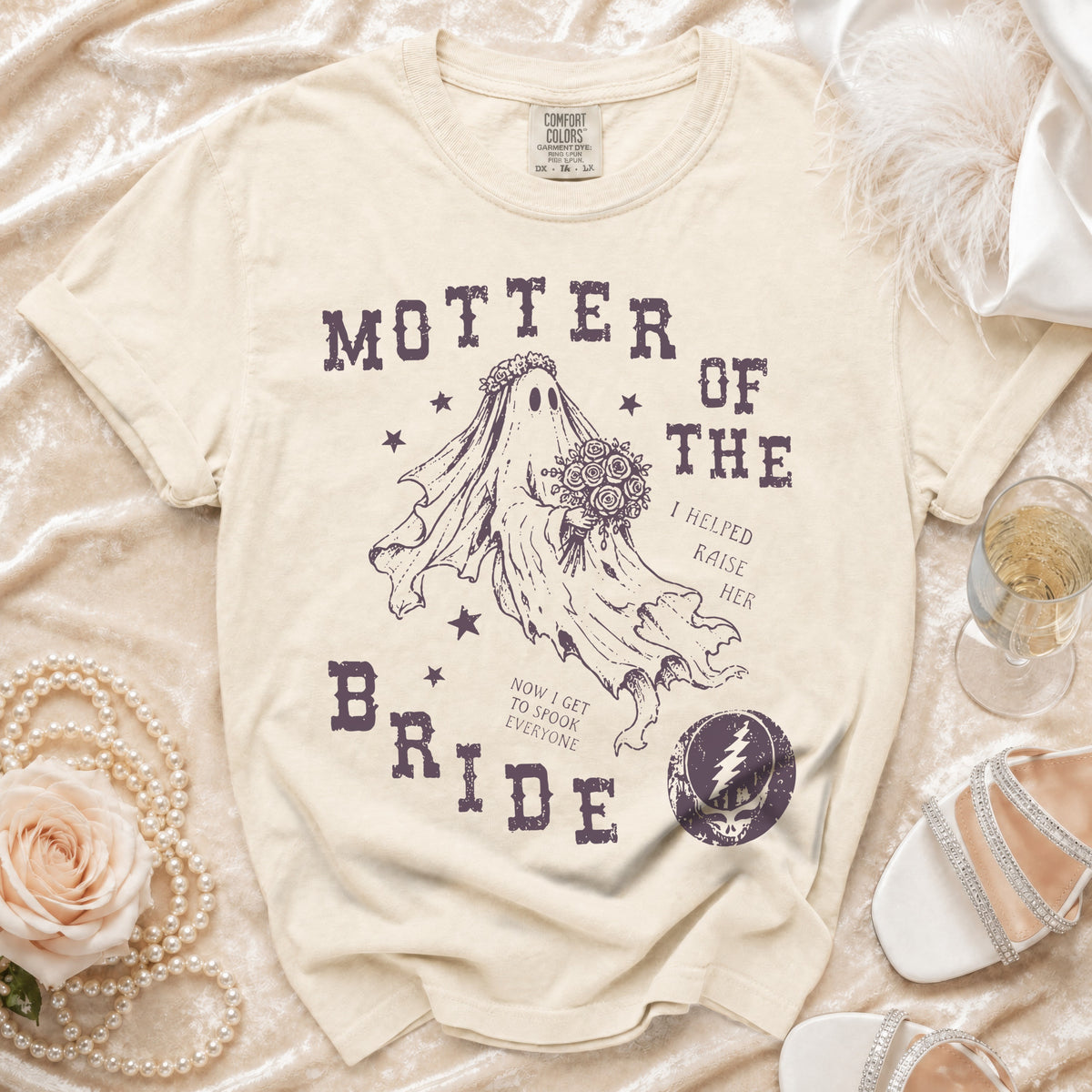 Cream t-shirt with "MOTHER OF THE BRIDE" text, ghost bride graphic, and bolt logo.