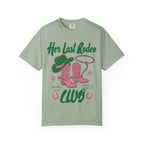 T-shirt with "Her Last Rodeo" text, cowboy boots, hat, and lasso.