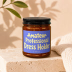 Brown glass jar with blue label reading "Amateur Professional Dress Holder" by Vowed.