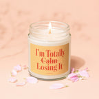 Lit candle with "I'm Totally Calm Losing It" text and "vowed" label.